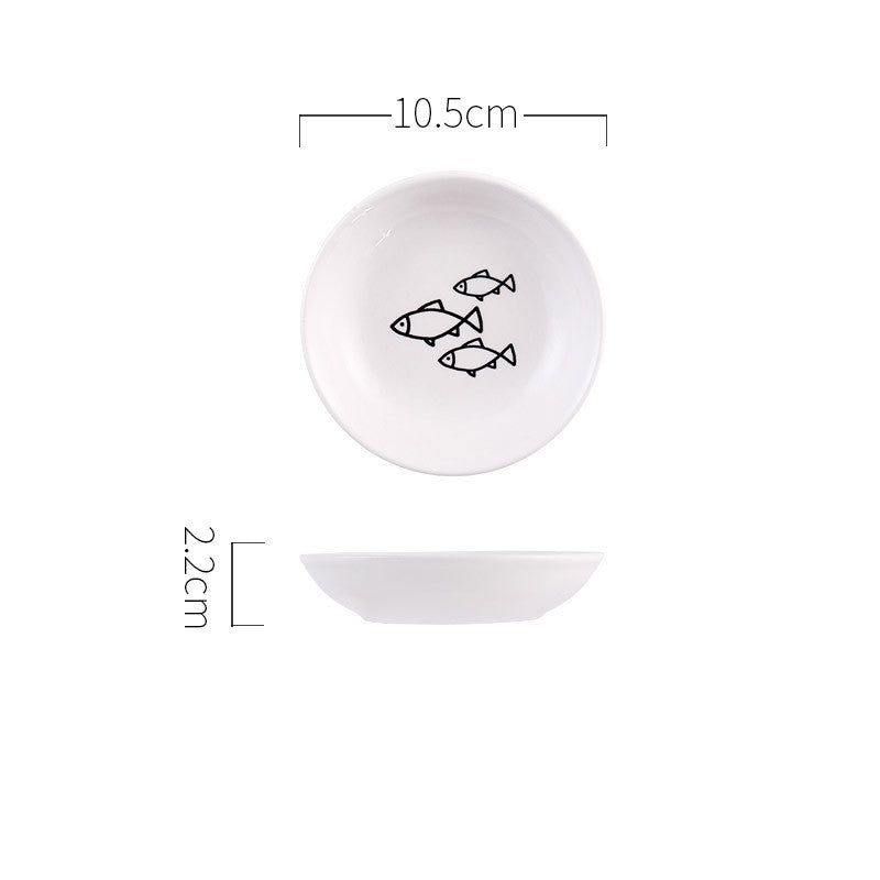 White ceramic plate with fish design and measurements on a white background