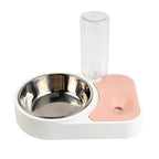 Pet bowl with a pink mat and a clear water bottle on a white background